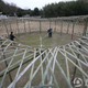 Illustration for article titled Chinese Farmers Build Birds Nest Stadium Out of Bamboo